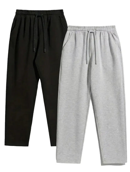 Black and gray jogger pants on a white background